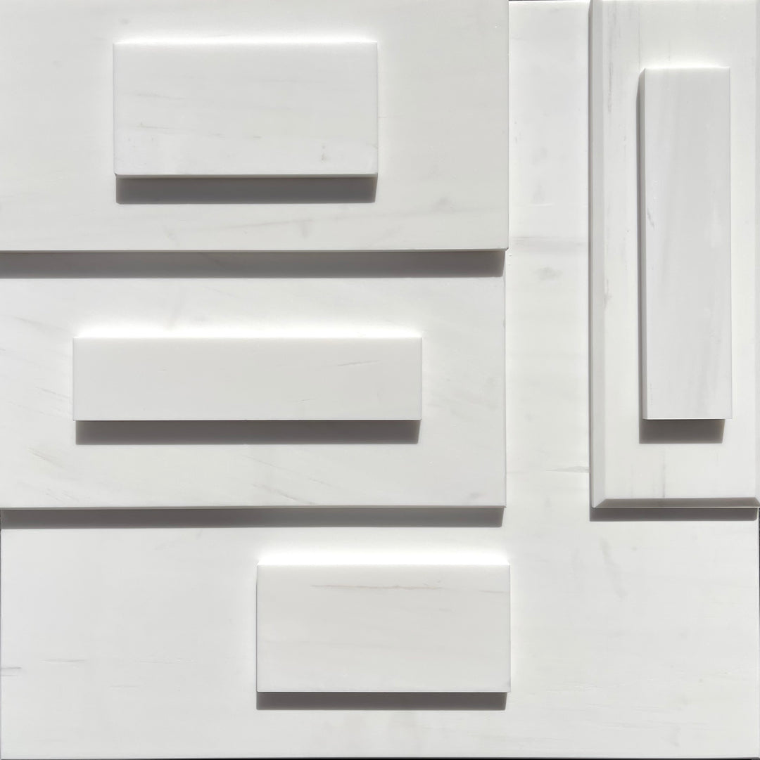 Tilehouz Bianco Dolomite white marble tiles on a white panel wall with raised rectangular accents.