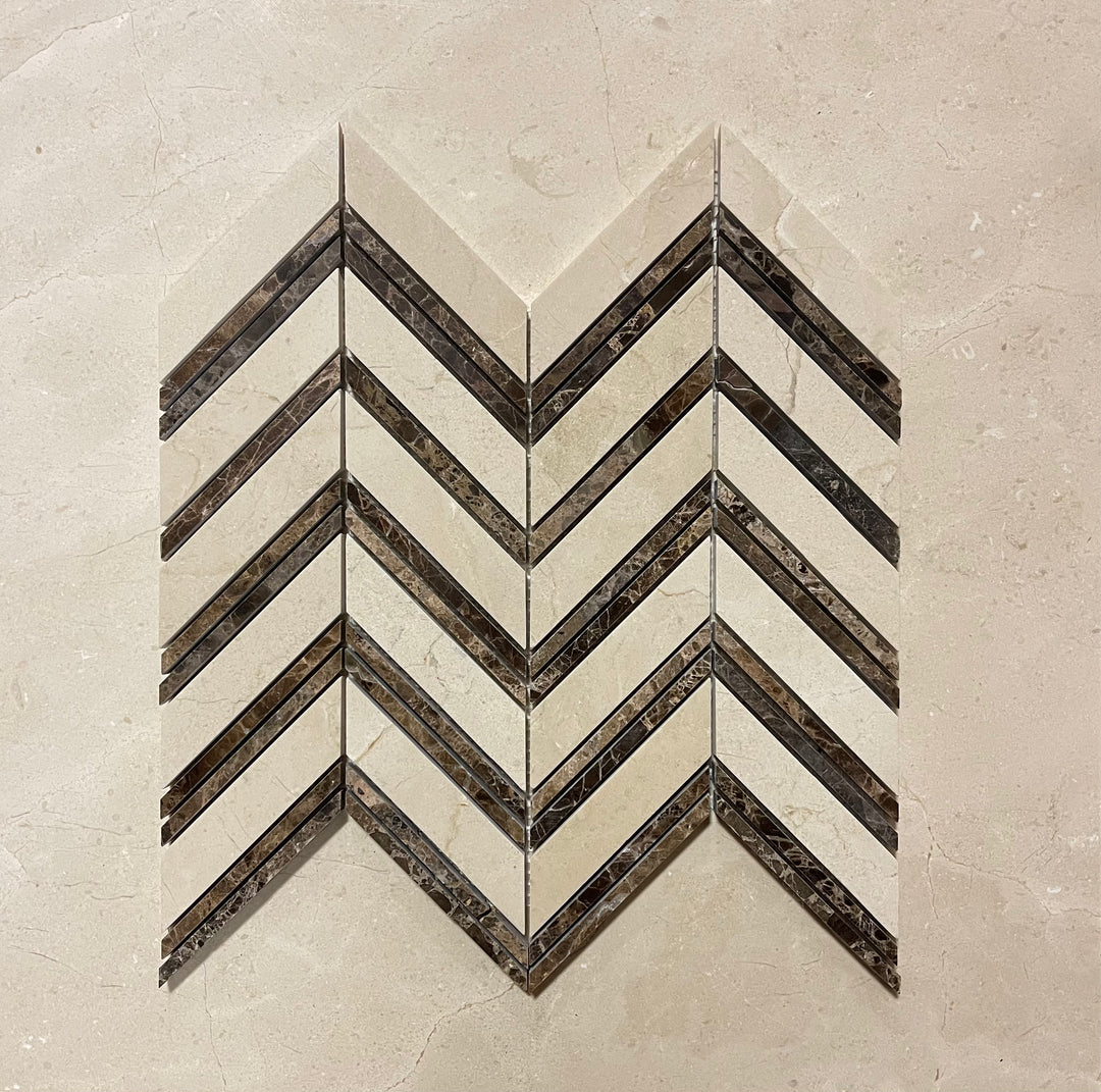 Crema Marfil marble chevron tile mosaic in beige and brown tones.