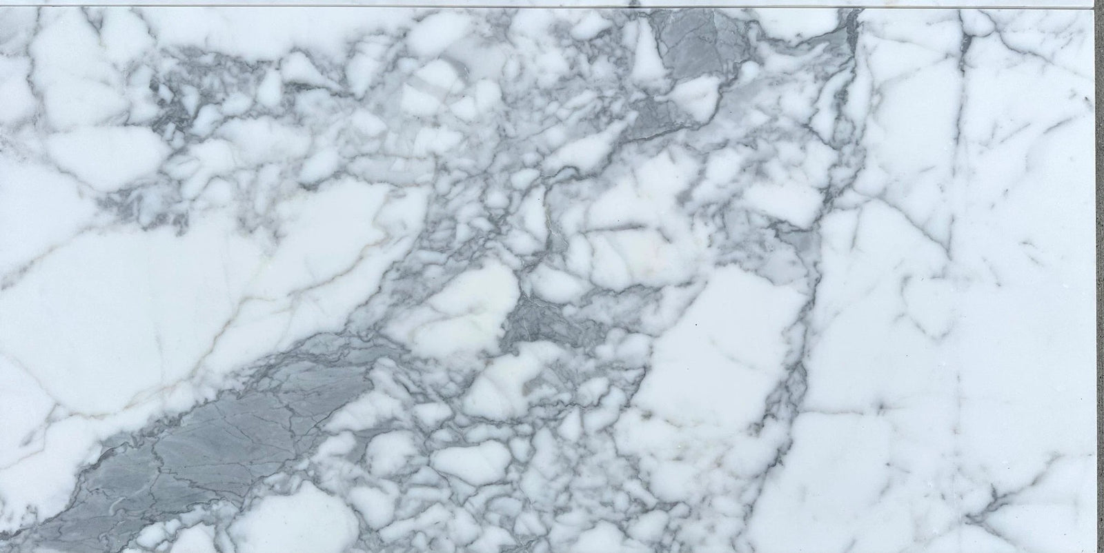 Statuario marble tile, honed white with gray veining, 18x36 by Tilehouz for wall & ceiling.