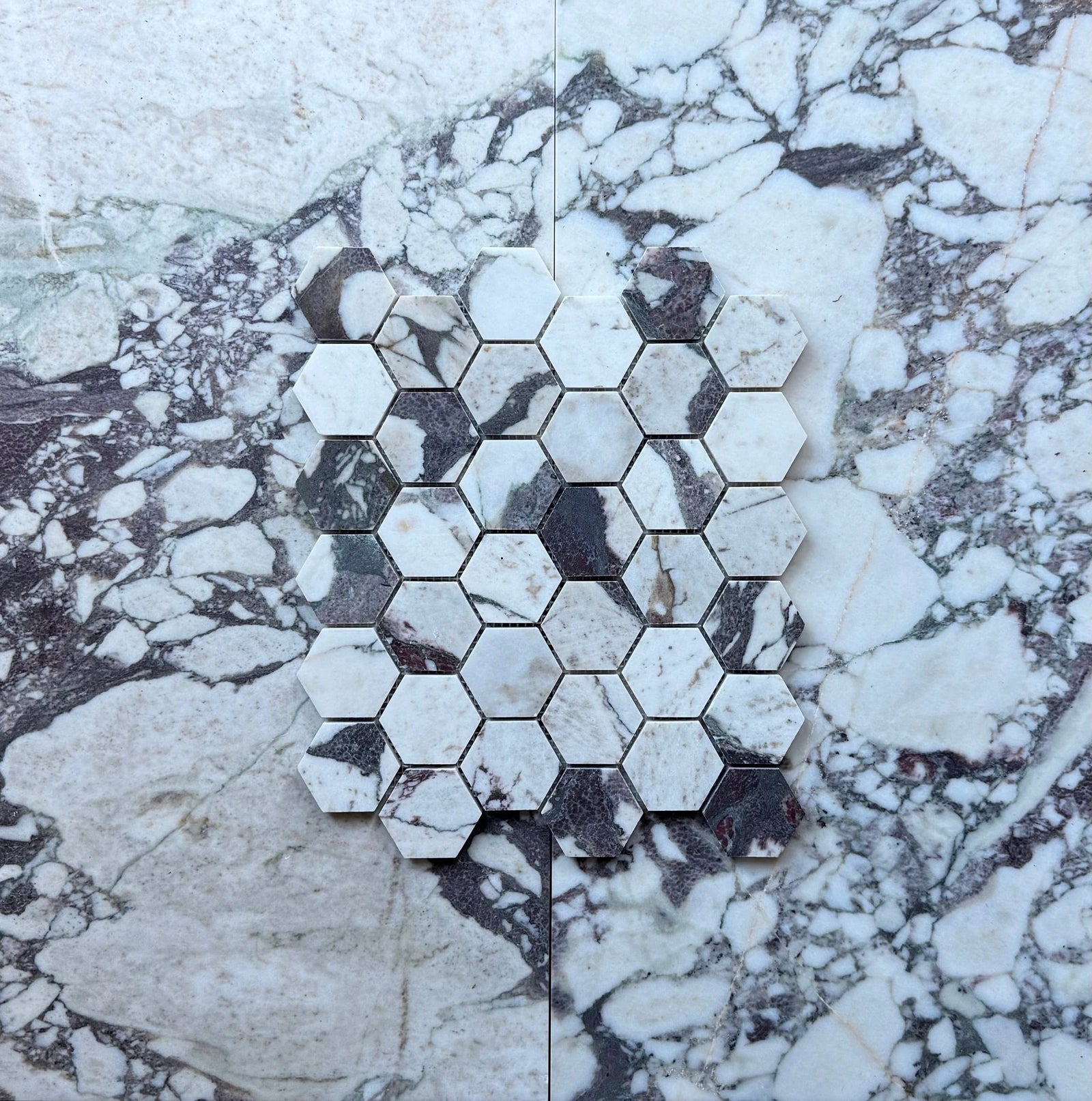Calacatta Viola Marble 2in Hexagon Mosaic Tile by Tilehouz; white with purple veining