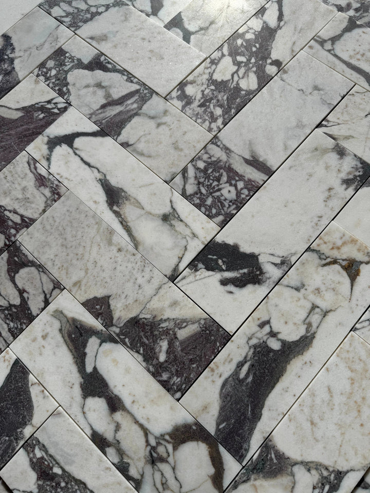 Calacatta Viola Marble Tile 4x12 by Tilehouz; white marble with dramatic purple-veined pattern.