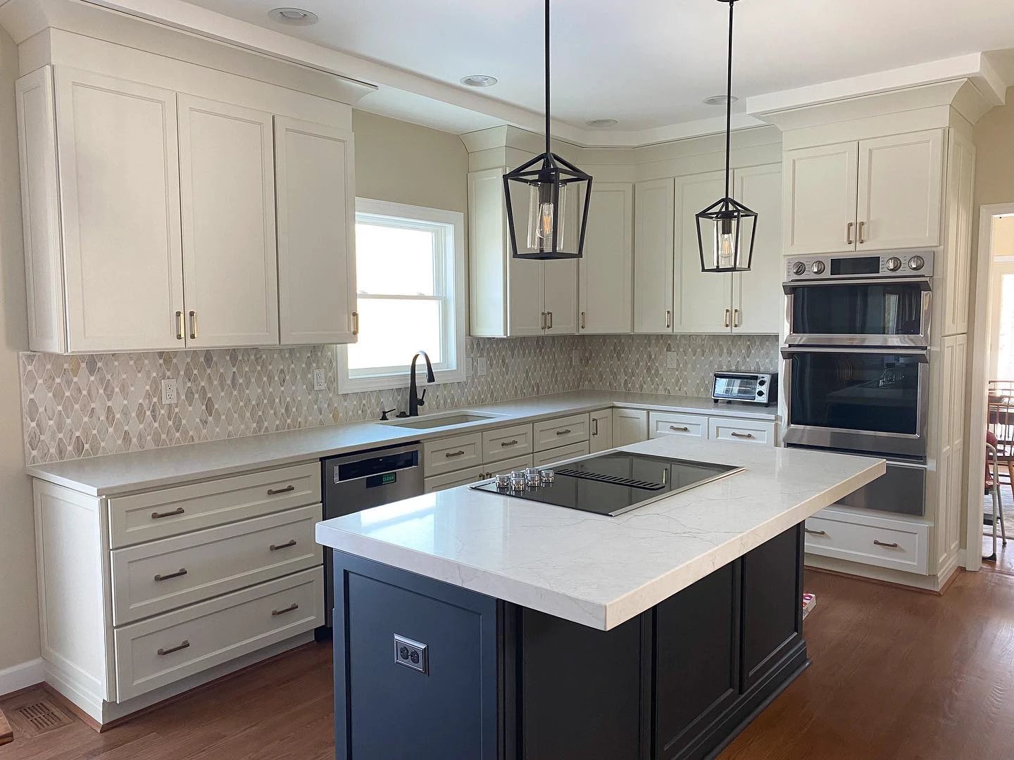 Angora Marble Polished Elongated Octagon Mosaic wall tile backsplash in a white kitchen with white cabinets and quartz