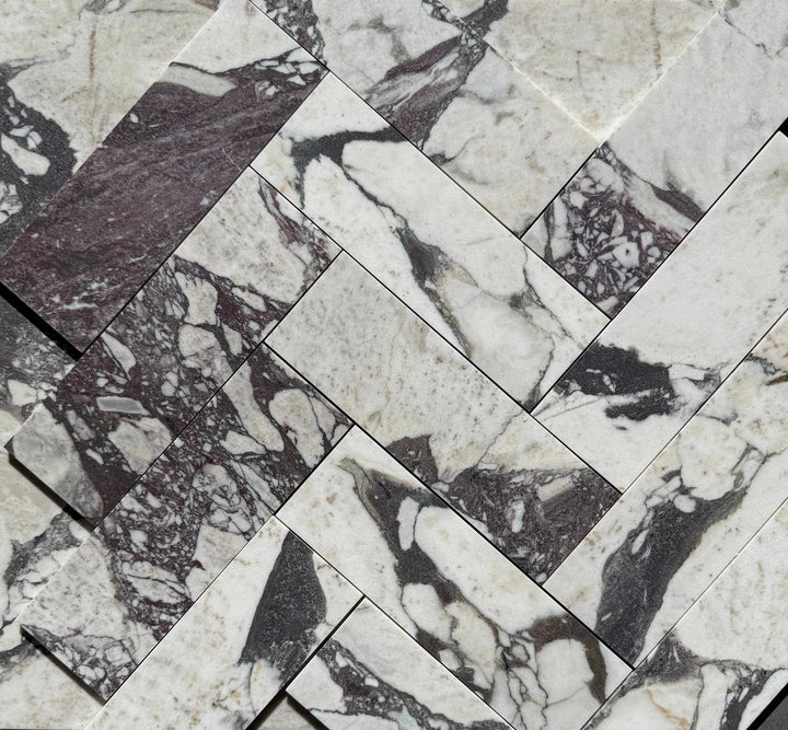 Calacatta Viola marble tile 4x12 by Tilehouz, white with purple veining, stacked sample tiles