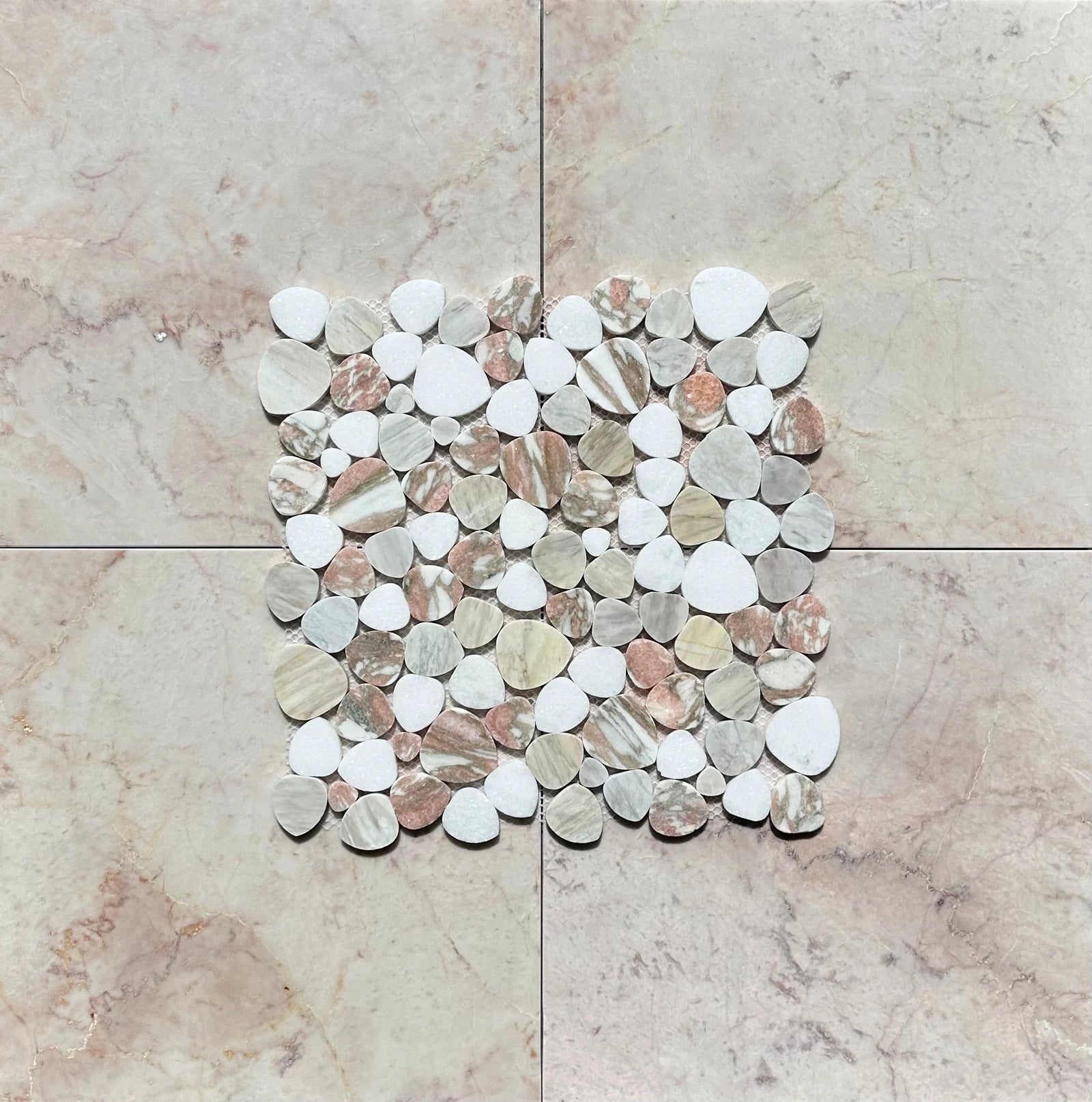 Aphrodite Soft Rose 12 x 12 marble mosaic tile with round pebbles in rose, beige and white tones.
