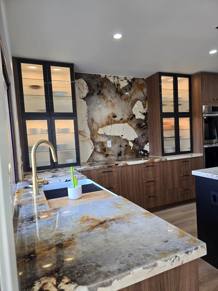 Quartzite Patagonia original polished slab countertops (127x79) with brown and cream veining in a modern wood kitchen.