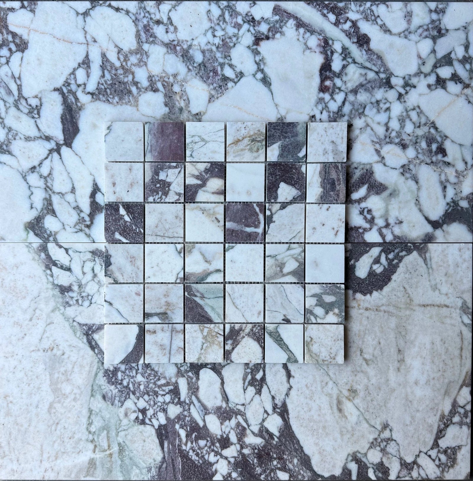 Tilehouz Calacatta Viola marble 2x2 square mosaic wall tile, white with purple veining.