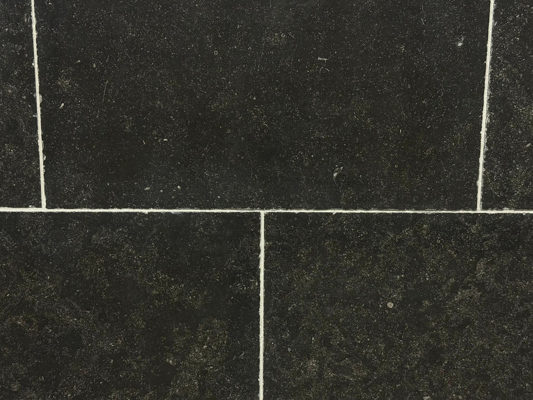 Pierre Bleu Belgian Limestone wall tile, 16x24 with antiqued edge; dark blue-black color, 4 tiles shown.
