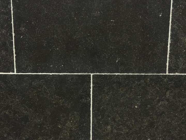 Pierre Bleu Belgian Limestone wall tile, 16x24 with antiqued edge; dark blue-black color, 4 tiles shown.