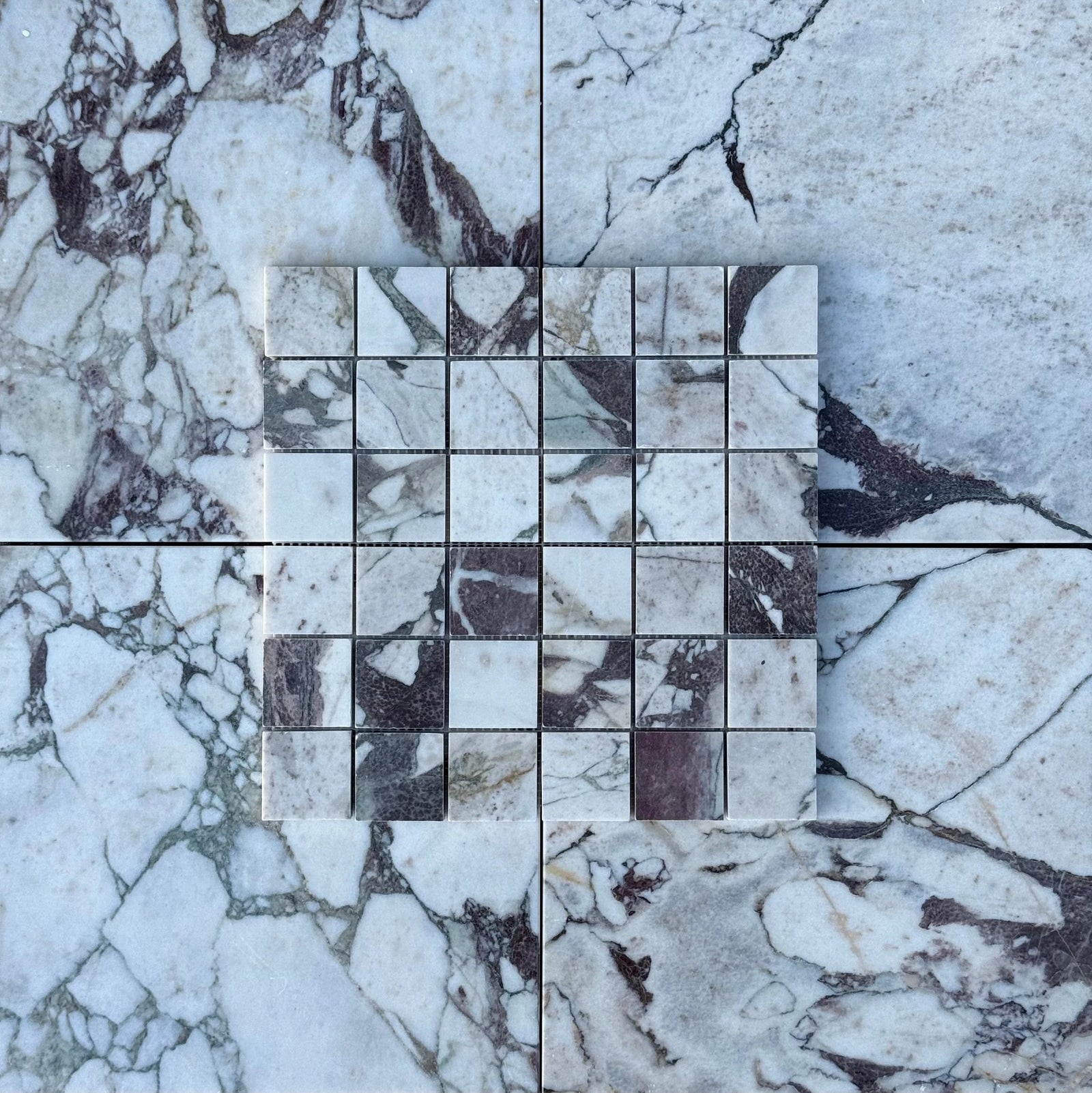 Calacatta Viola marble 2x2 square mosaic by Tilehouz for wall & ceiling tiles; white with dark veining.