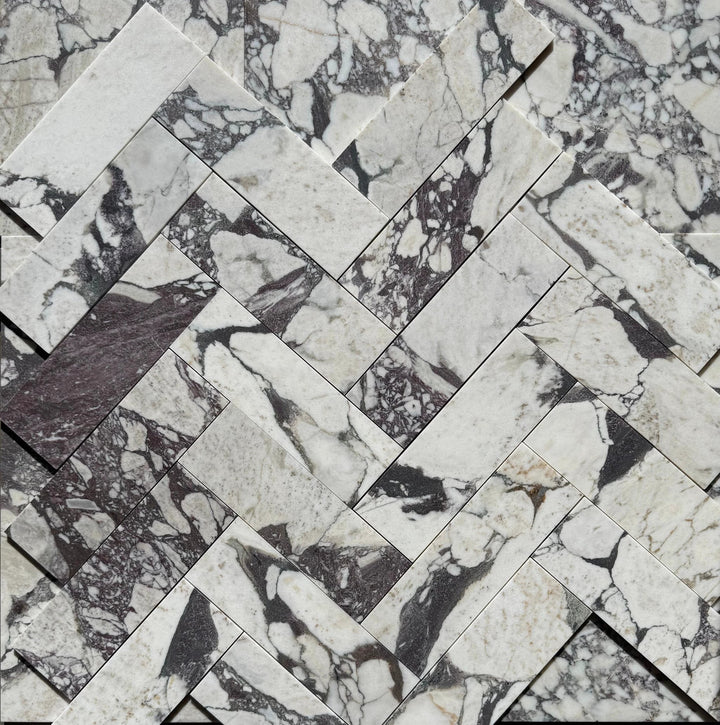 Calacatta Viola Marble Tile 4x12 by Tilehouz; white marble with purple veining in a herringbone mosaic