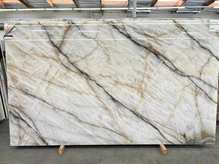Cristallo Vitrum slab by Tilehouz, polished white countertop with gray, black and gold veining, 126 x 75.