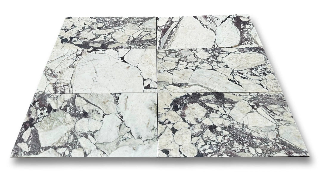 Calacatta Viola marble tile 12x24 by Tilehouz, six white tiles with gray-purple veining for wall &amp; ceiling.