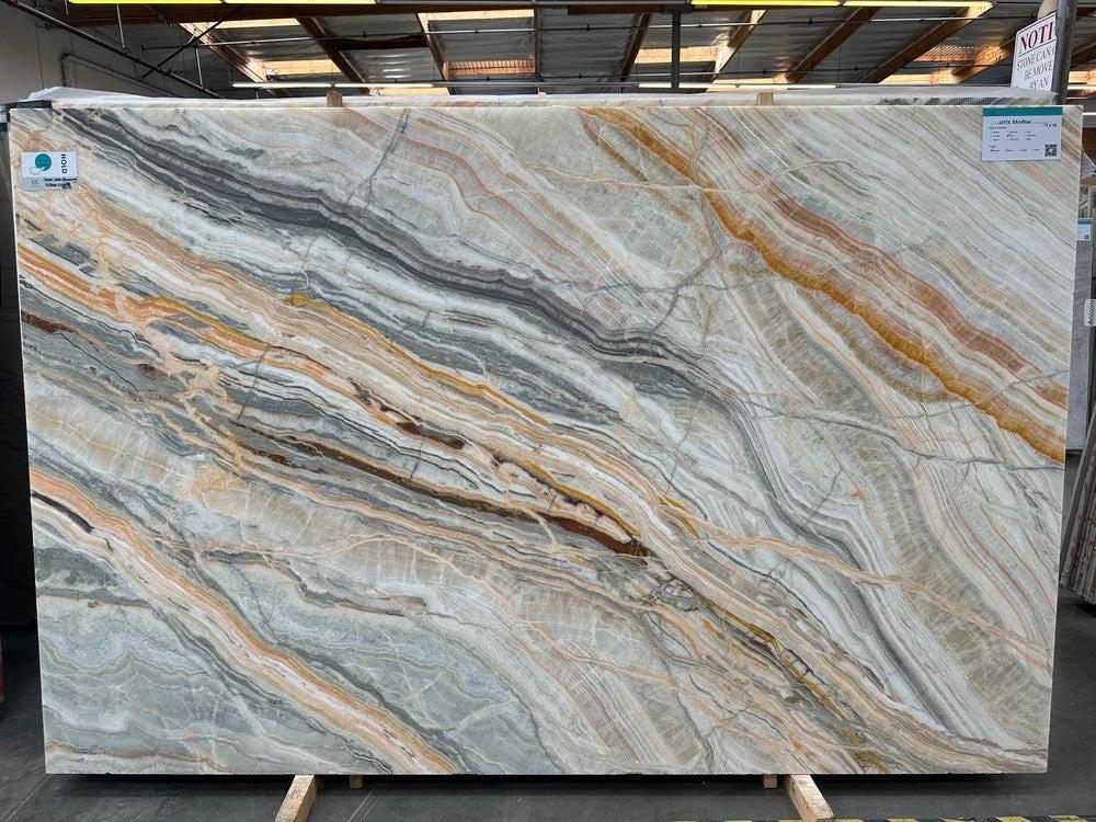 Onyx Rainbow polished slab countertop by Tilehouz with vivid multi-color veining and gray base, 114 x 73