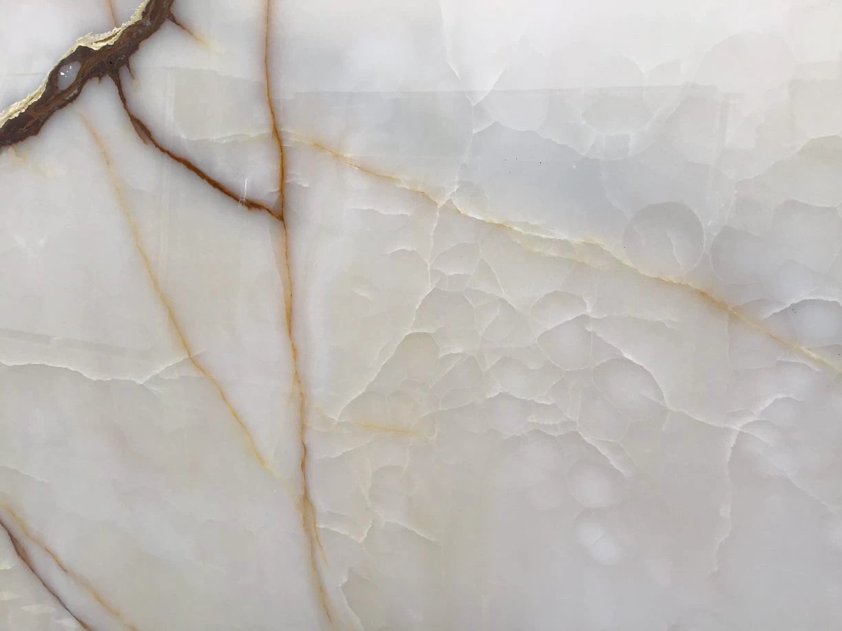 ONYX Snow White polished slab with golden-brown veining for countertops, 116 x 45, Tilehouz