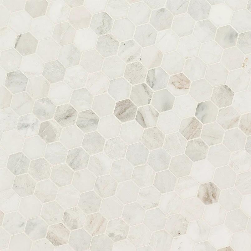 Arabescato Venato White 2-inch hexagon marble wall tile, honed finish.