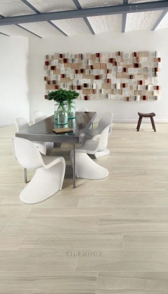 Artwork Corian 12x24 porcelain tile by Tilehouz; beige plank flooring in a modern dining room