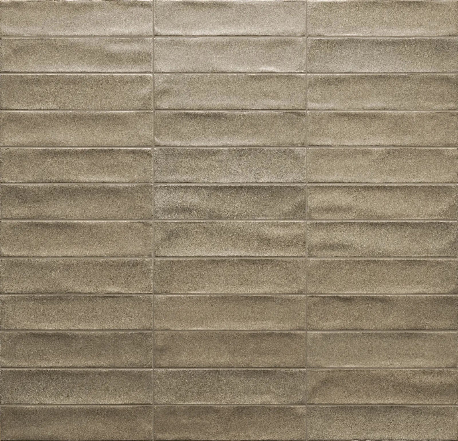 Porcelain tile Cruda Brick Beige; 2x8 in brick-pattern with textured beige surface