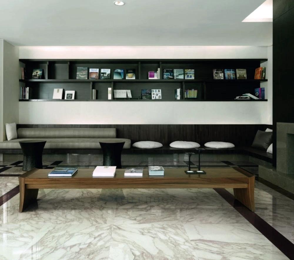 Bianchi Calacatta Luc 32x71 porcelain tile, white with gray veining, showroom floor display.