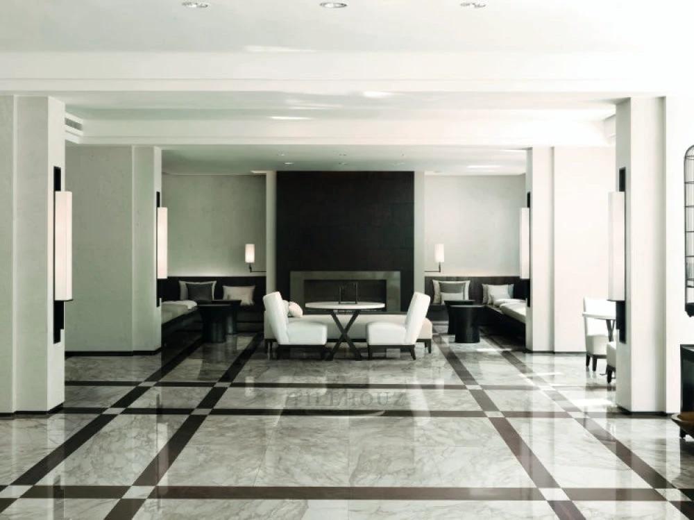 Bianchi Calacatta Luc 32x32 porcelain tile; white marble-look flooring in a modern lobby