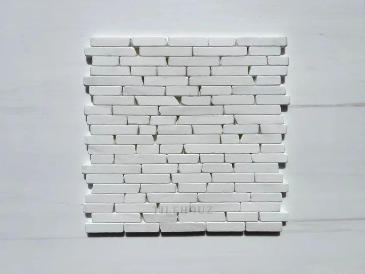 Bianco Dolomite Manhattan random strip tumbled marble mosaic by Tilehouz for wall tiles