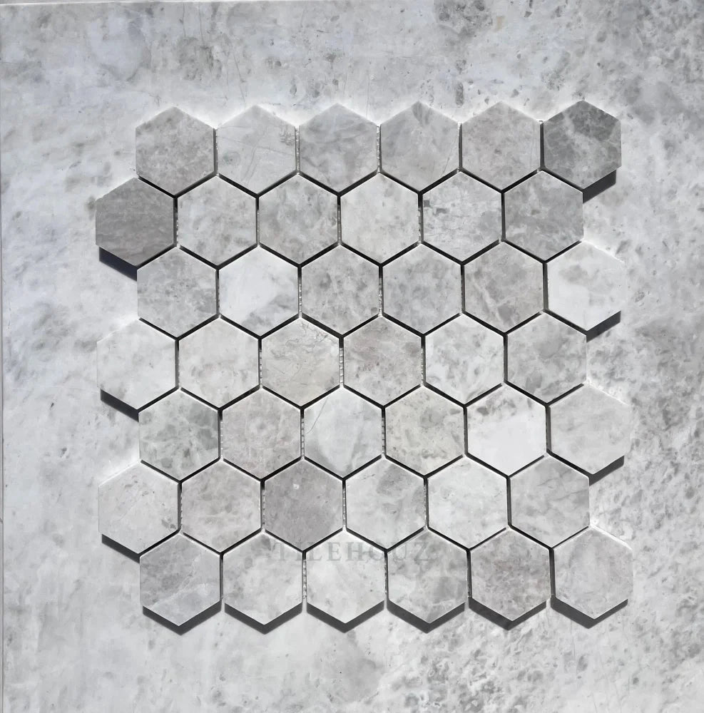 Bianco Gris Dolomite 2-inch hexagon leathered marble mosaic tile in soft icy white by Tilehouz for walls