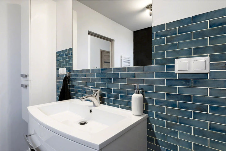 Blue Storm 2x6 glass subway tile by Tilehouz; blue pearl-like wall tile for bathrooms.