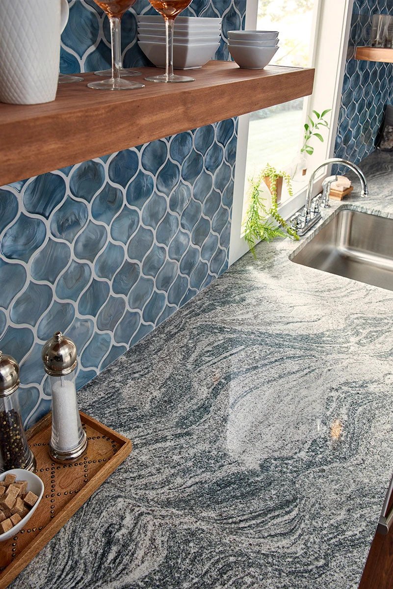 Blue Storm Arabesque Glass Mosaic backsplash tile by Tilehouz; blue pearl-like glossy glass wall tile.