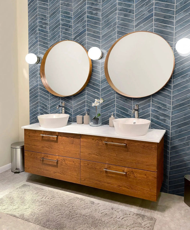 Blue Storm Glass Chevron Mosaic wall tile by Tilehouz; blue, pearl-like glossy glass finish.