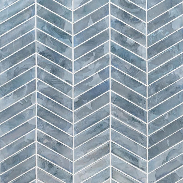Blue Storm Glass Chevron Mosaic tile by Tilehouz; blue pearl-like glossy glass wall tile