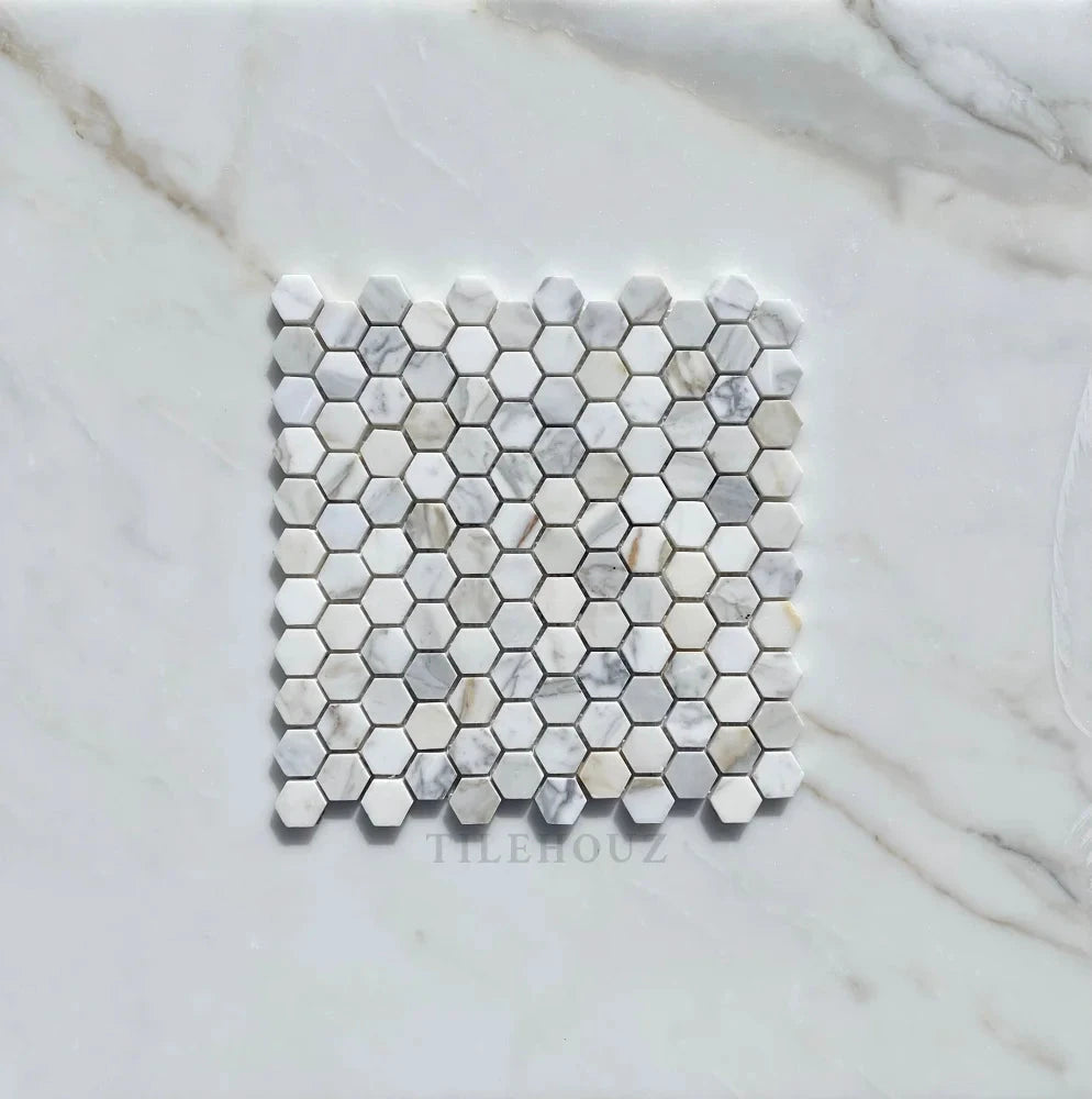 Tilehouz Calacatta Gold Marble 1in hexagon mosaic tile sheet in white with gray veining, polished and honed
