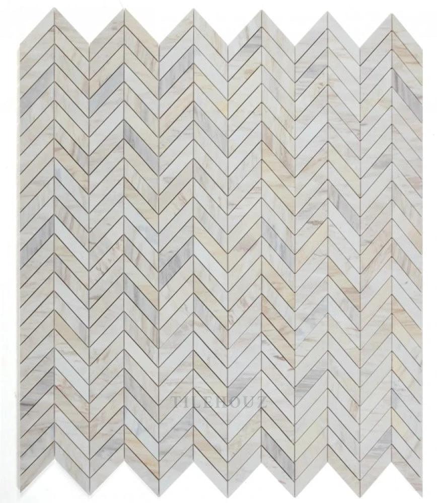 Chevron Eurasian 11 x 11 marble wall tile by Tilehouz, with a light gray and beige chevron mosaic.