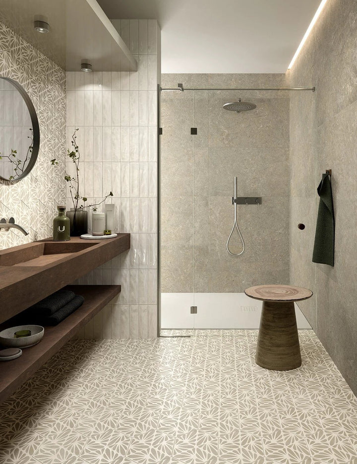 Terracreta Intarsio Argilla hexagon porcelain tile, 8.5x10, light neutral geometric pattern on bathroom floor.