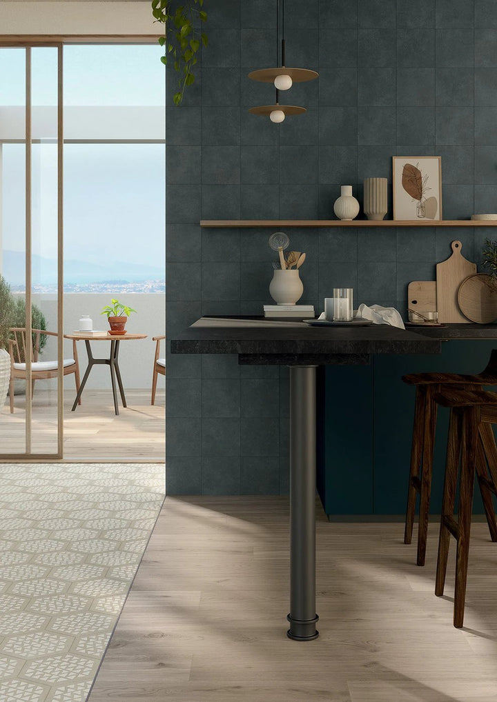 Terracreta intarsio argilla hexagon porcelain wall tile, 8.5x10, in deep teal shown in a modern kitchen setting