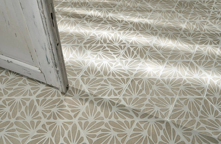 Terracreta Intarsio Argilla hexagon porcelain tile in beige and white with a floral petal motif.