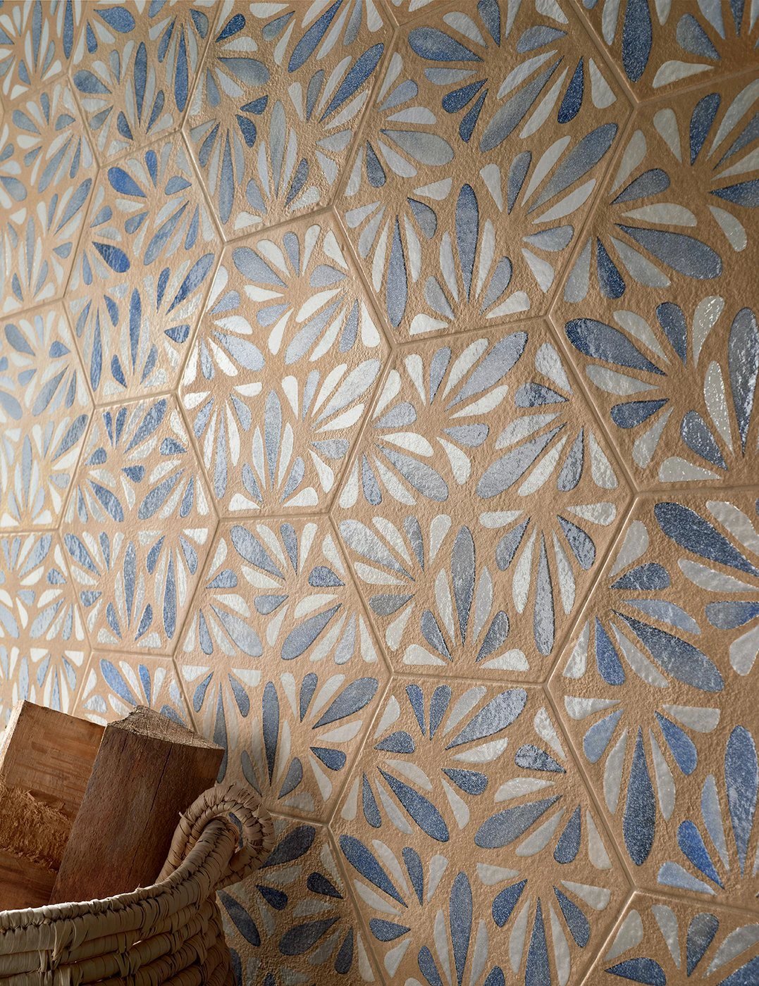 Terracreta Intarsio Argilla hexagon porcelain wall tile with beige floral cutouts and blue accents.