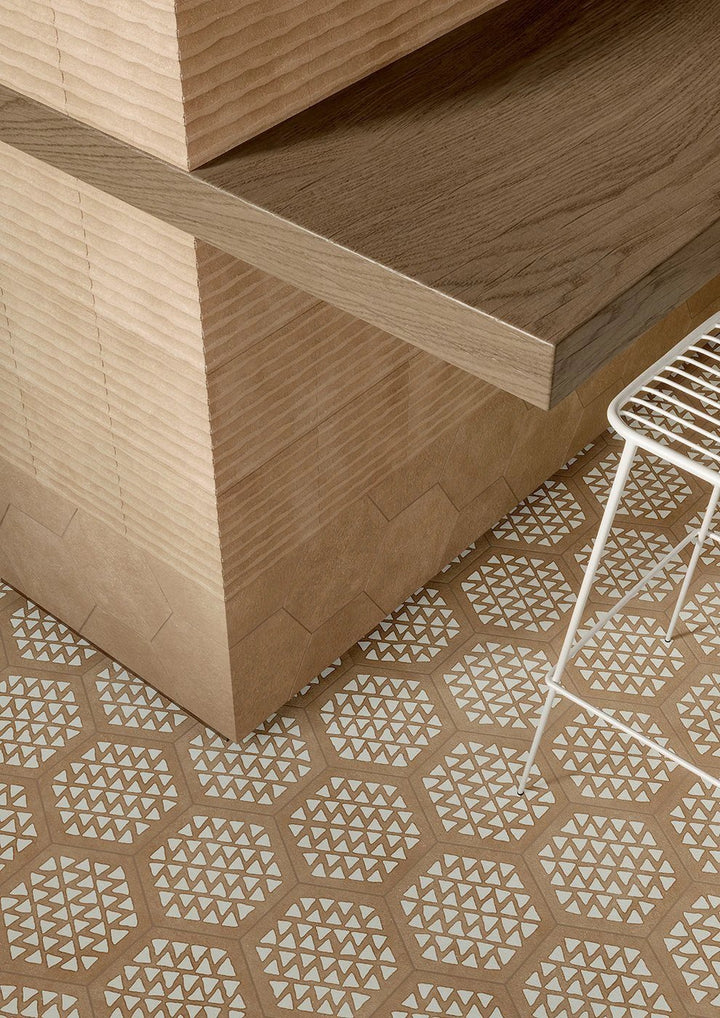 Terracreta Intarsio Argilla hexagon porcelain tile, tan color with white triangle pattern on floor