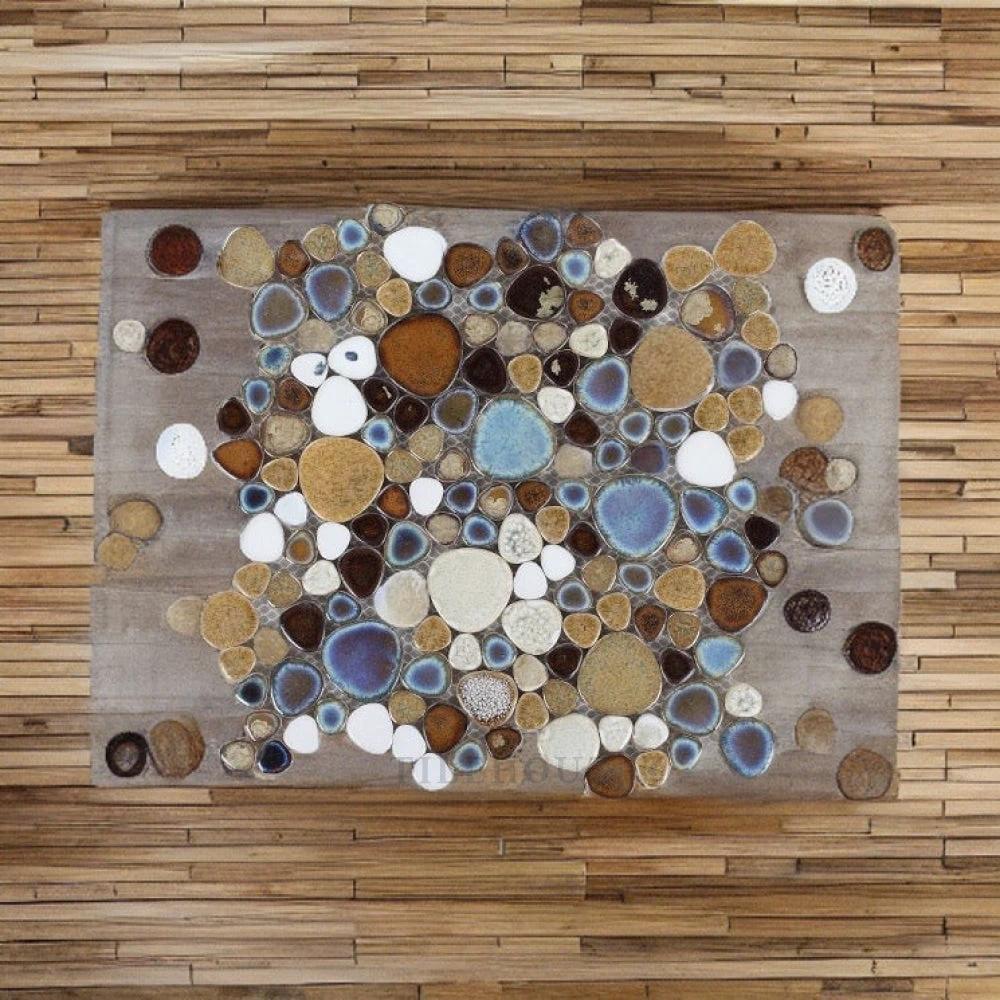 Growing Mango Pebble 11.5x11.5 porcelain mosaic tile by Tilehouz, handmade pebble design in blues, browns and creams
