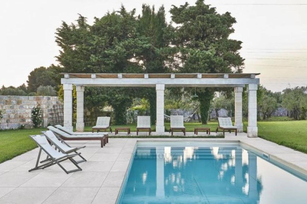 HCX201 Beige 2cm Porcelain Paver 24x24 by Tilehouz for pool deck; paving around a pool with lounge chairs.