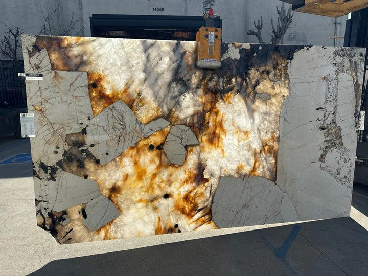 Quartzite Patagonia Original polished countertop slab; white and cream base with rust-brown veining, 127x79 cm.