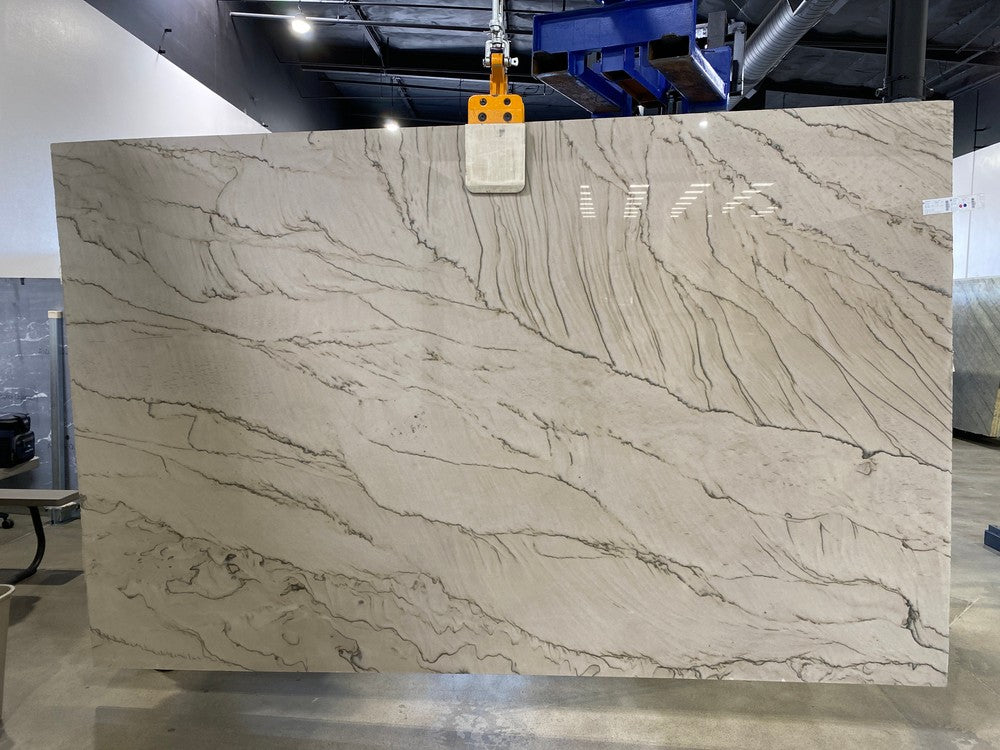 Quartzite slab White Duna with gray veining, polished countertop material.