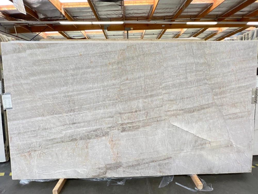 Quarzite Renoir leather slab countertop in light grey with subtle veining