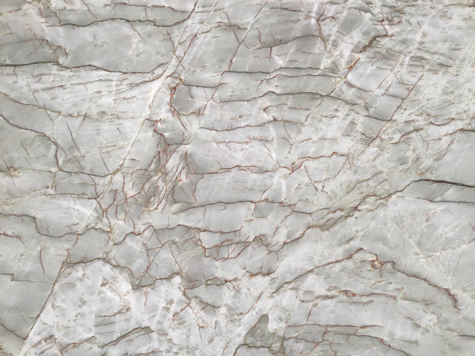 Quarzite slab, Equilibrium polished countertop by Tilehouz, light gray with red-brown veining