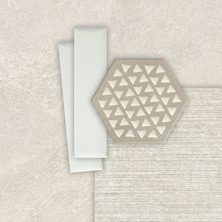 Terracreta hexagon porcelain tile Argilla 8.5x10 with white triangular pattern