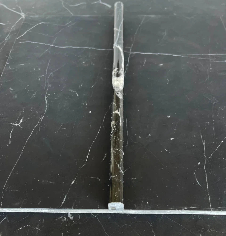 Nero Marquina marble 1/2in pencil liner, polished/honed, black with white veining