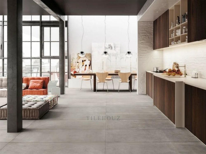 Plain Nickel porcelain tile 30 x 60, large gray tile in a modern open-plan kitchen with wood cabinetry by Tilehouz.
