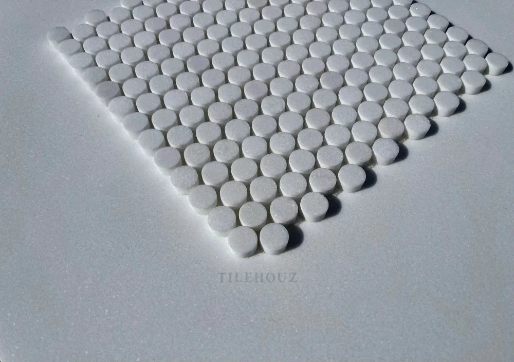 Thassos white marble penny-round mosaic tile sheet by Tilehouz, polished and honed.