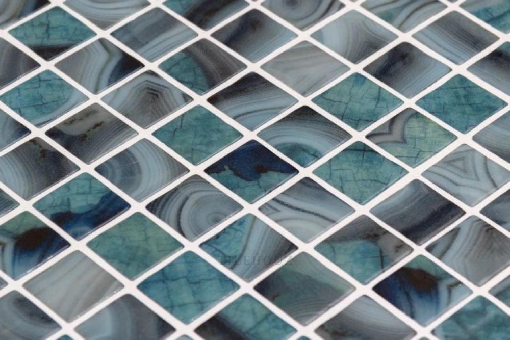 Tilehouz Vanguard Borneo glass mosaic tile, 12.25 x 18.5 inches, blue-green swirled squares with white grout
