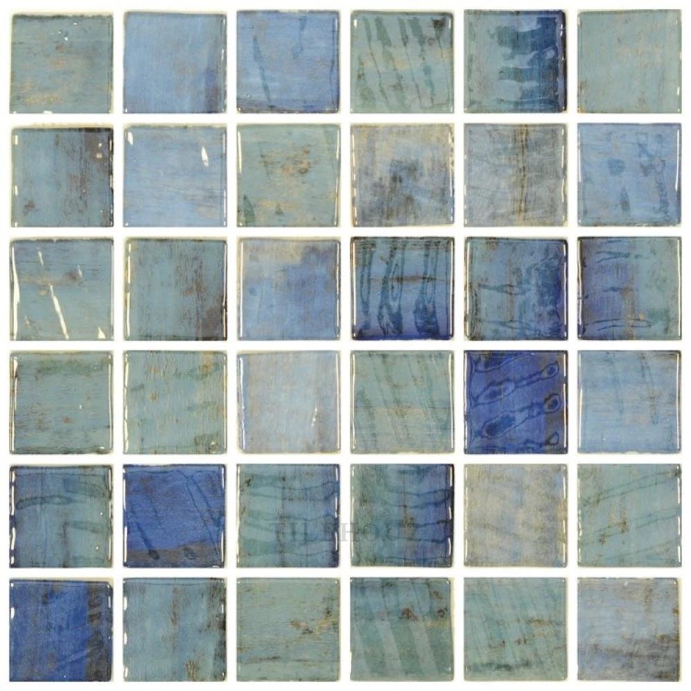 Glass mosaic tile sheet Vanguard Penta Forest Blue with square blue-green glass tiles.
