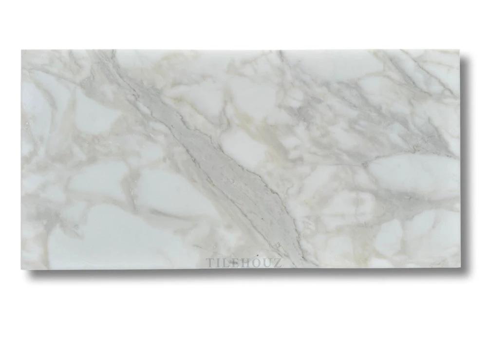 Calacatta Gold marble 18x36 tile by Tilehouz, polished and honed.