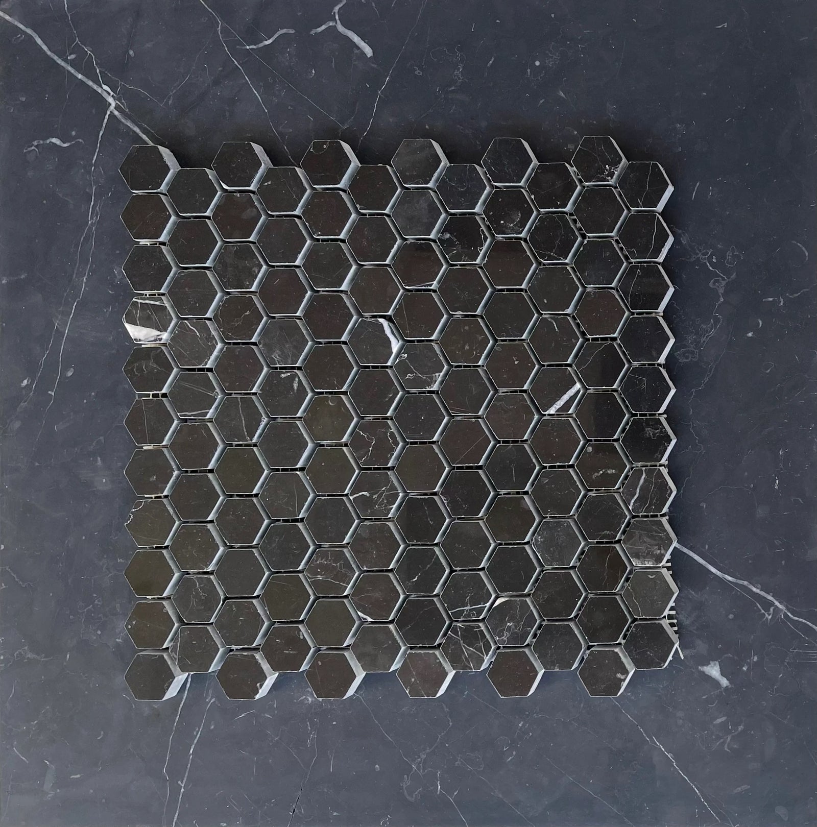 Nero Marquina Marble 1-inch hexagon mosaic tile by Tilehouz; black polished/honed marble for wall & ceiling.